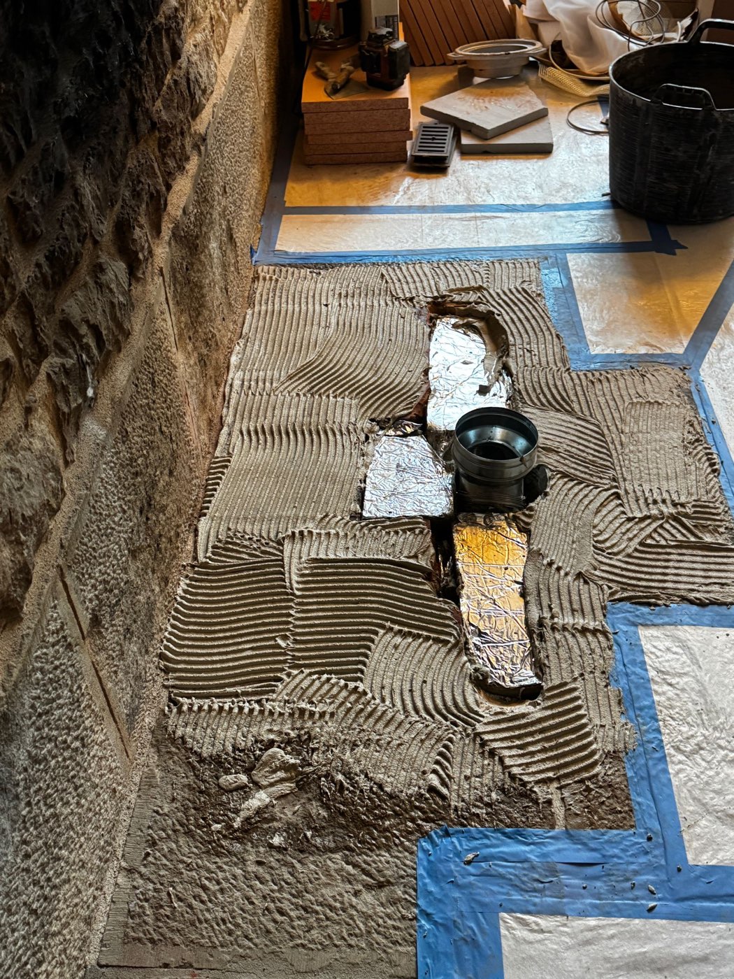 Foundation and footing — Inside the old fireplace, a masonry heater