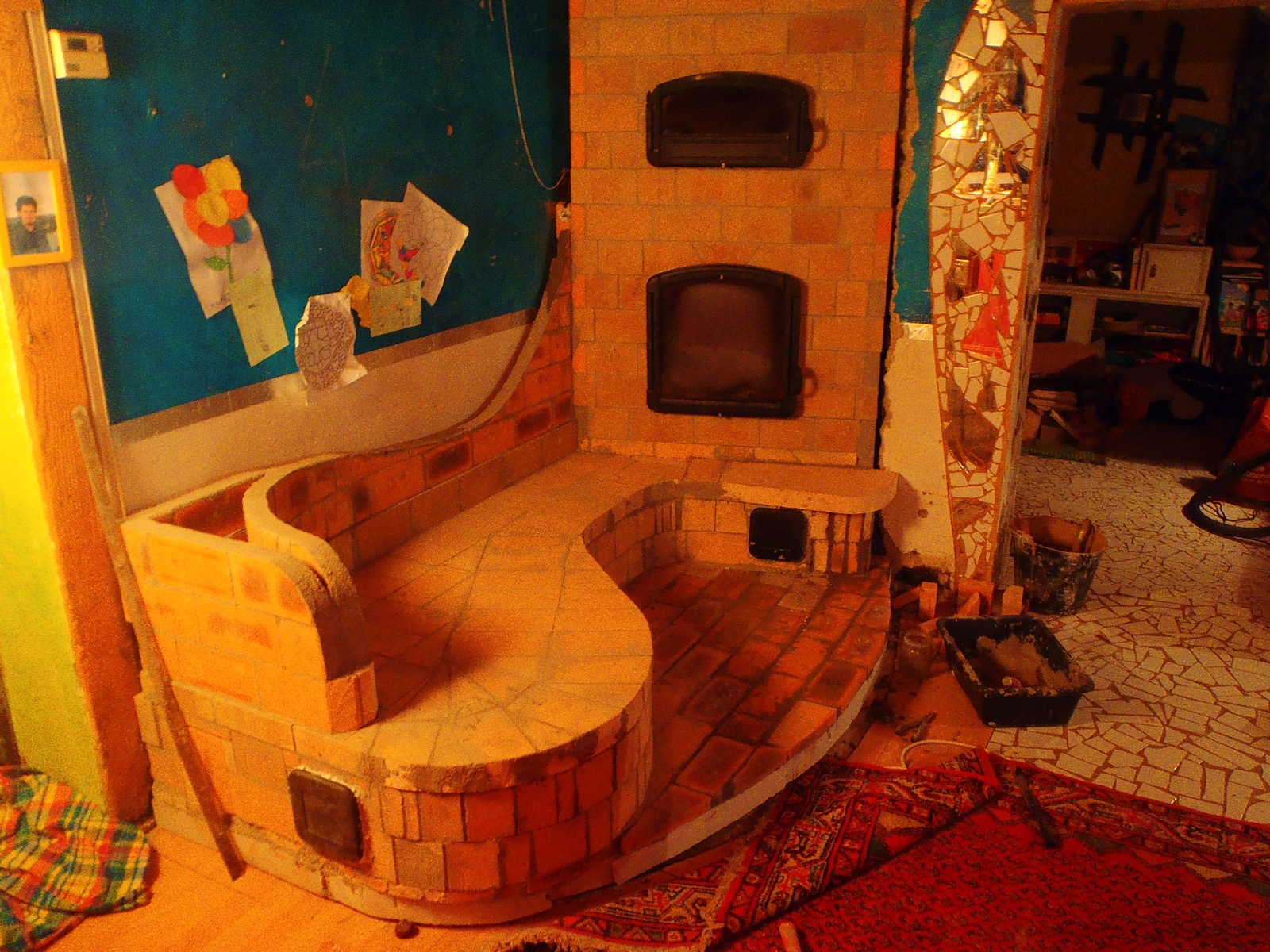A wave-shaped heated bench, brick by brick