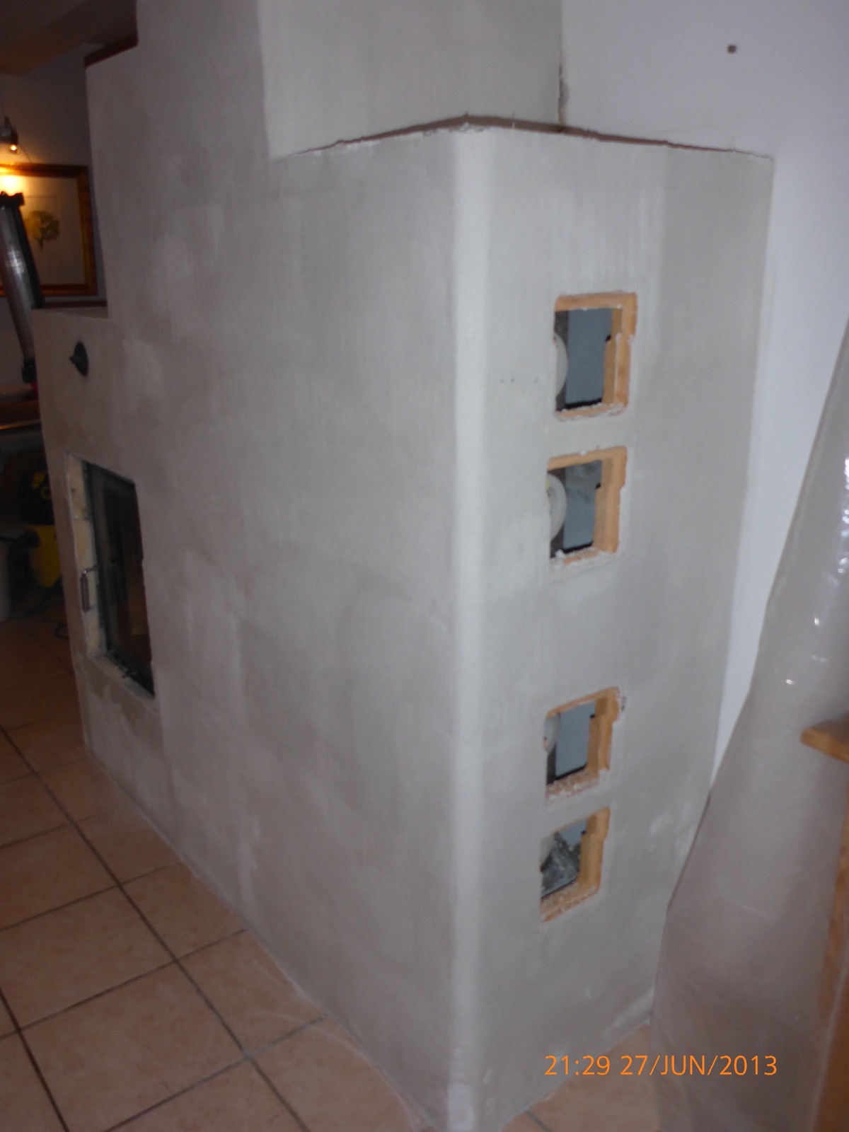 Side of the heater being rendered, with four square cleaning-door openings still open