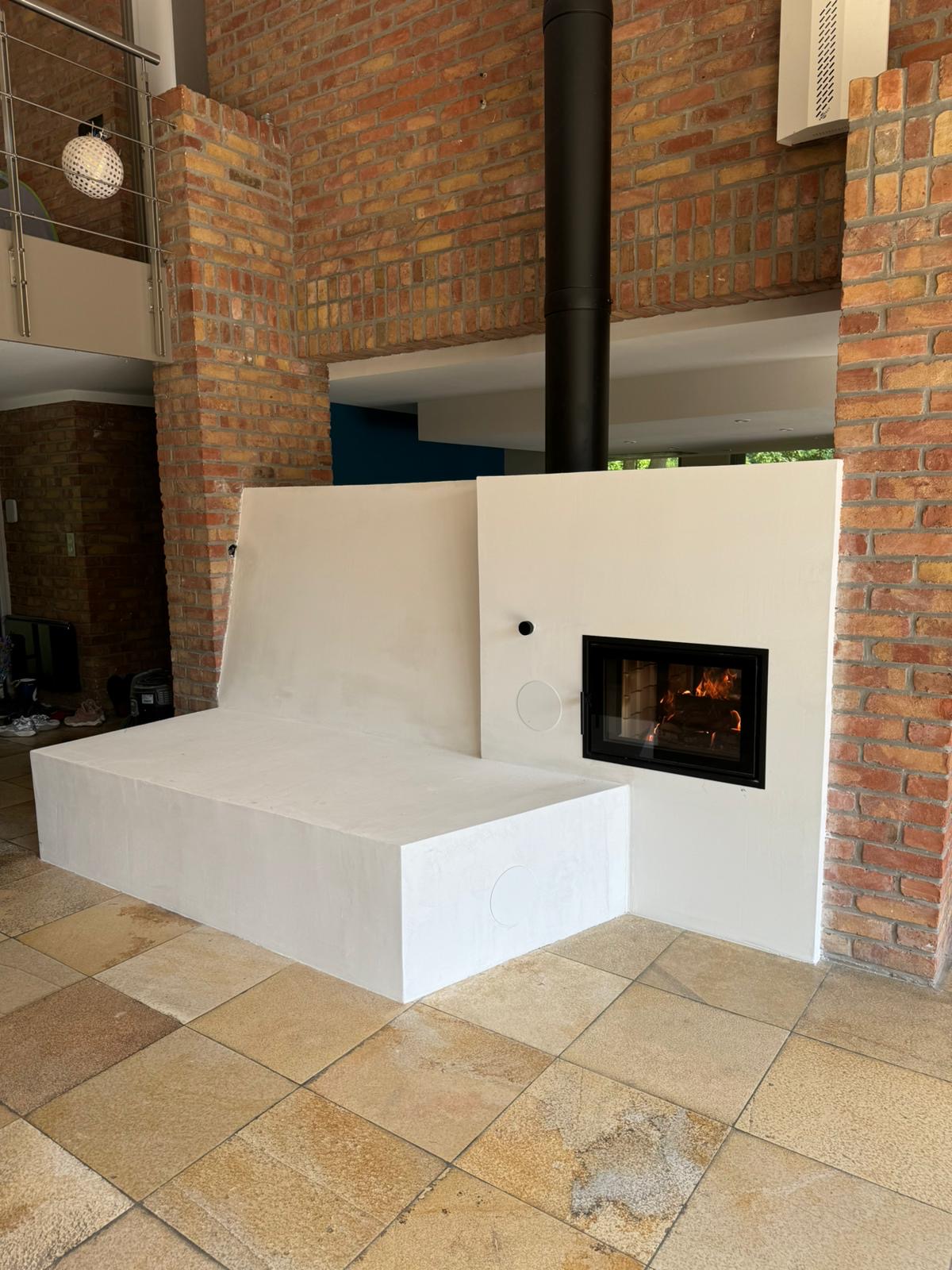 A see-through heater between two rooms, under the mezzanine