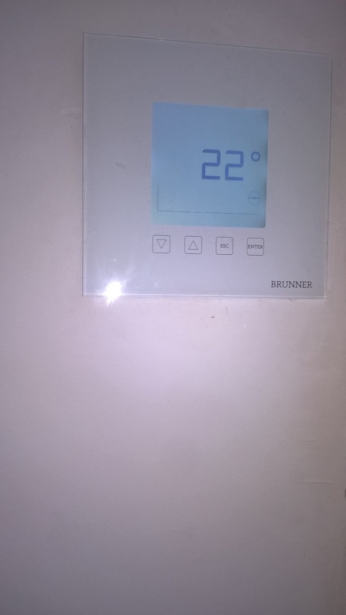 Brunner electronic controller screen recessed into the wall, showing 22 degrees