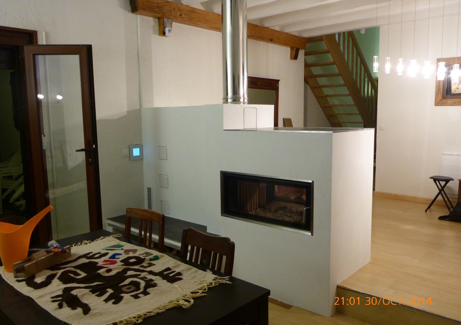 A see-through firebox between the dining room and the living room