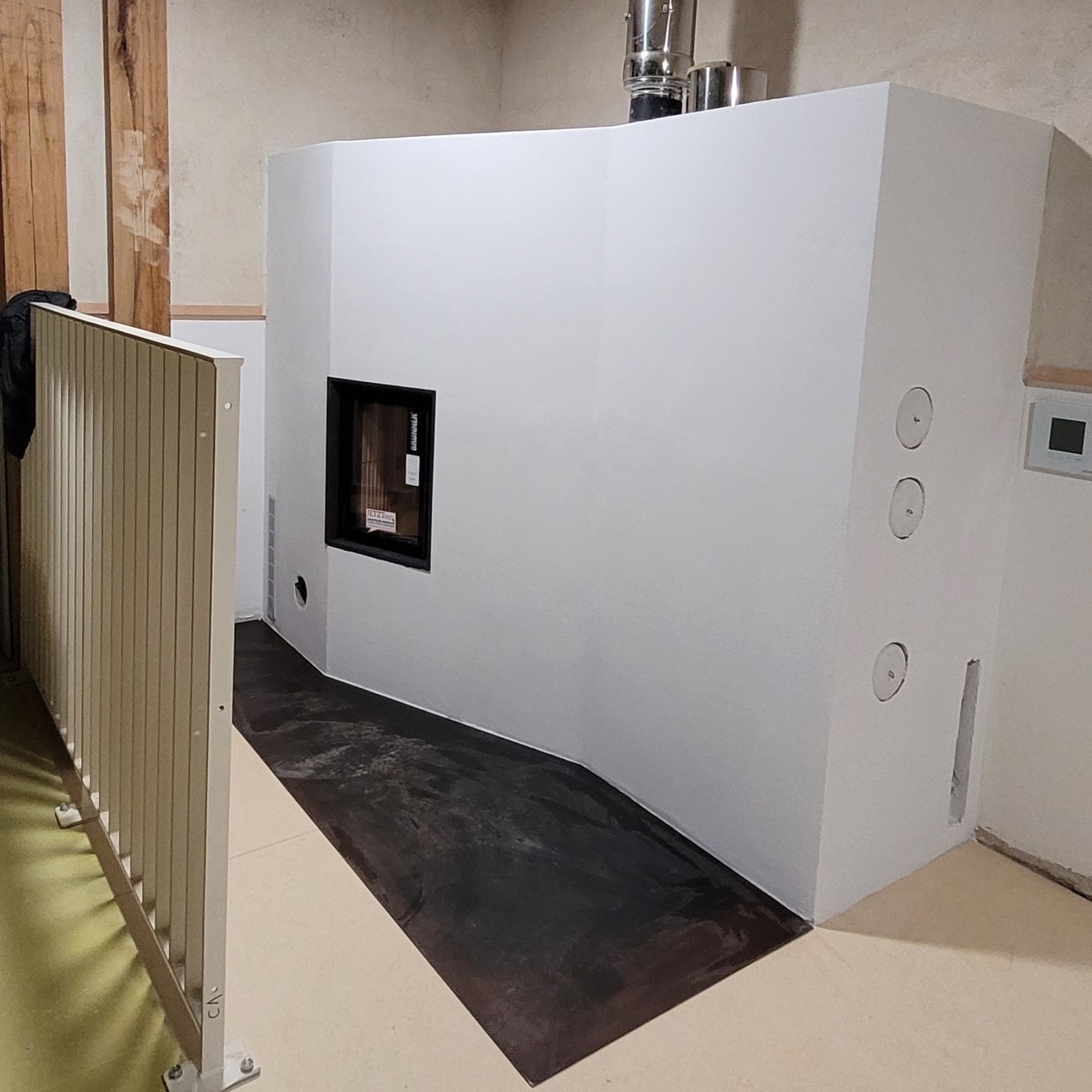 Two masonry heaters for the Mermoz school complex in Rosny-sous-Bois