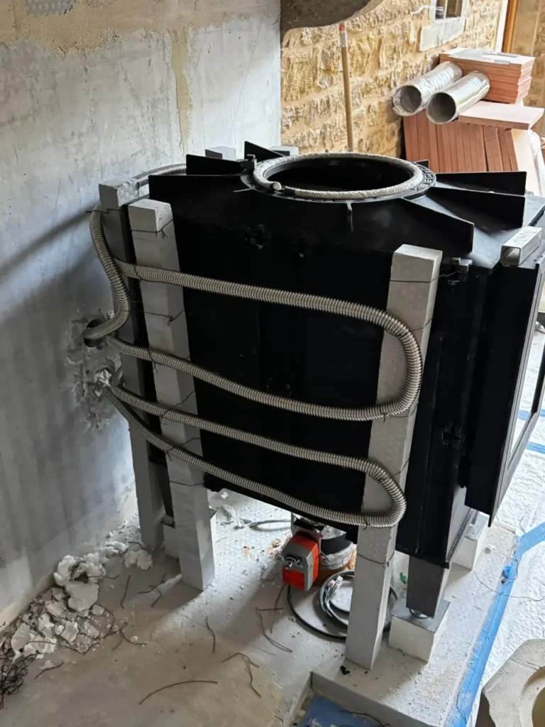 Installing the heater core — Inside the old fireplace, a masonry heater