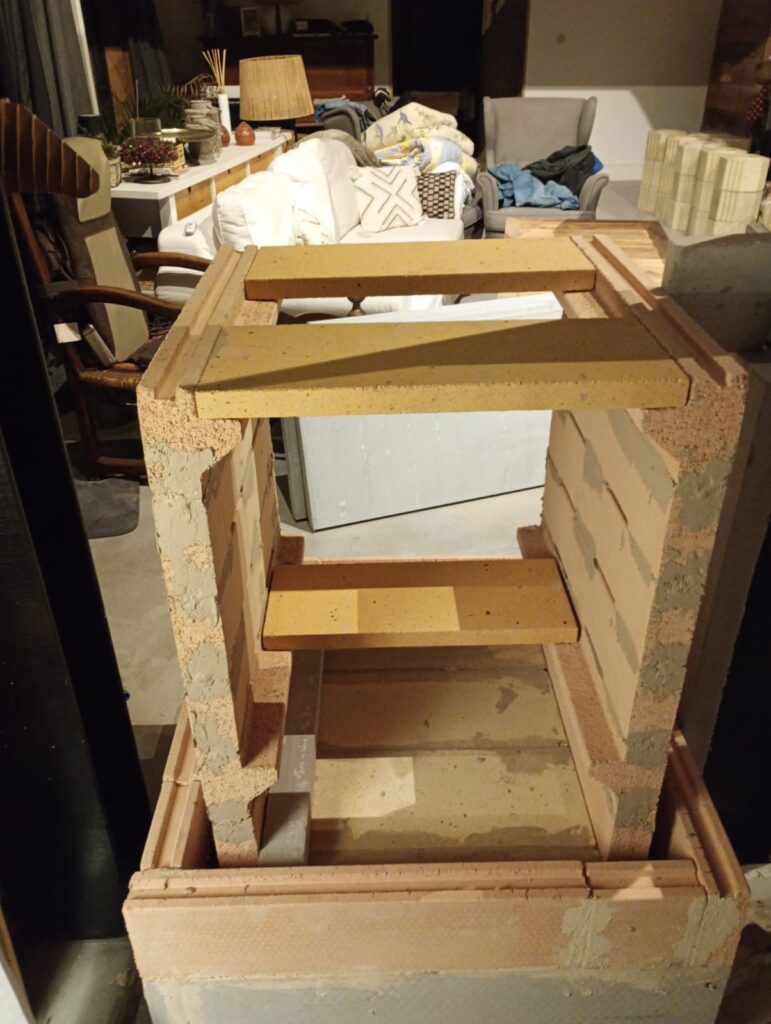 Firebrick heater core built up to height, seen from above, before the circuit is closed